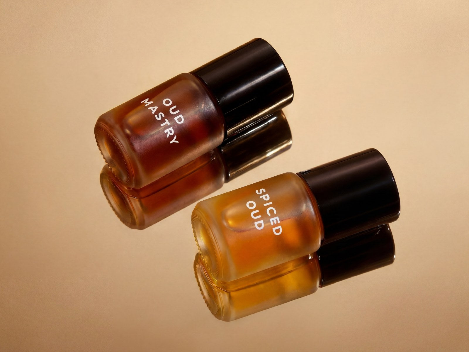 Oud Mastry and Sweet Oud rollerballs side by side