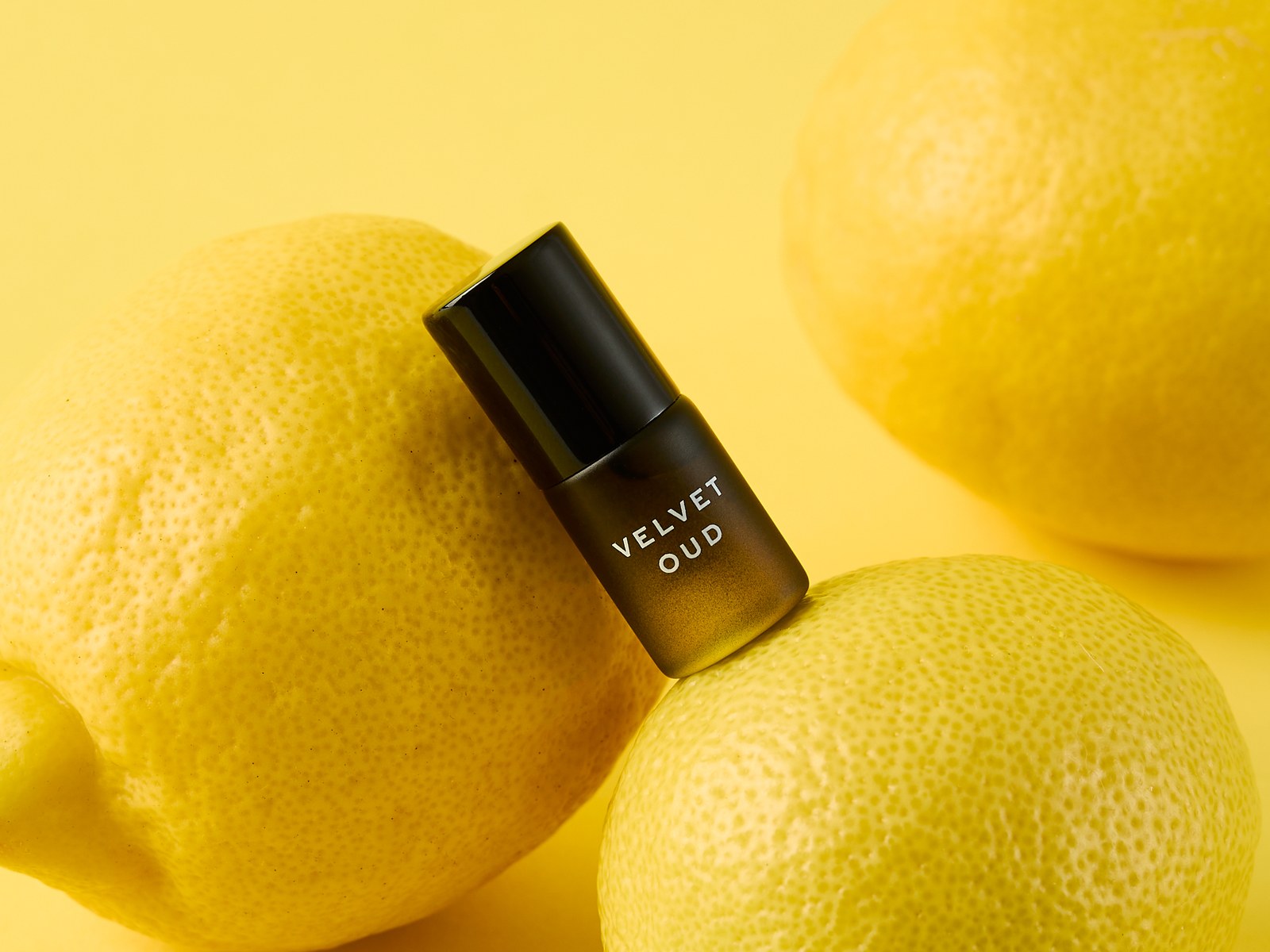 Velvet Oud rollerball with lemons on yellow